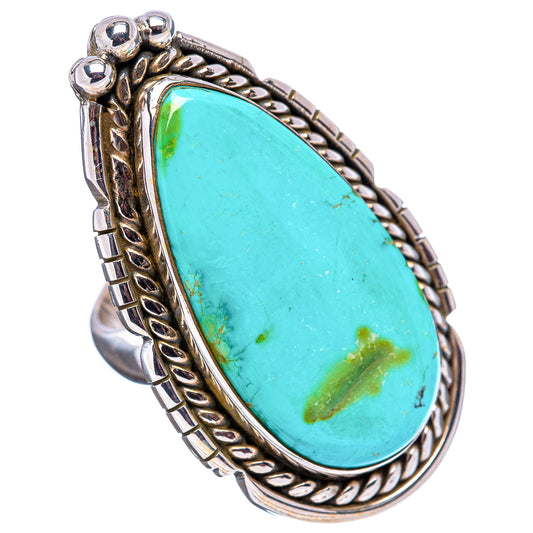 Sterling silver adjustable ring with oval turquoise stone and ornate rope-edge setting