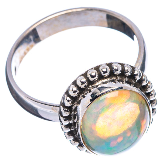 Sterling silver opal ring, oval opal set in raised beaded bezel on wide band