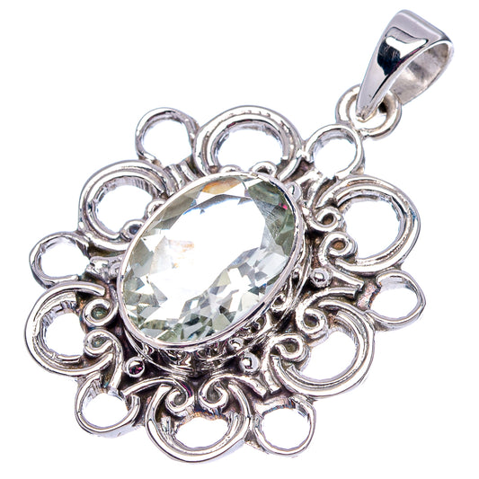Oval faceted clear stone pendant in ornate .925 sterling silver frame and bail