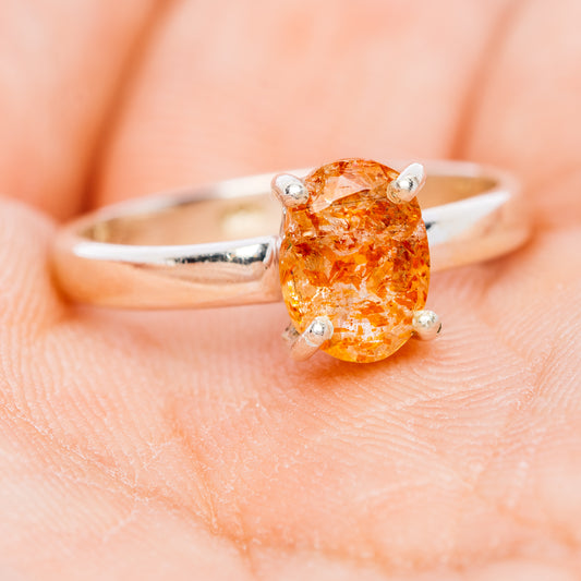 Oval faceted sunstone ring, .925 sterling silver, slim band with three-prong bezel