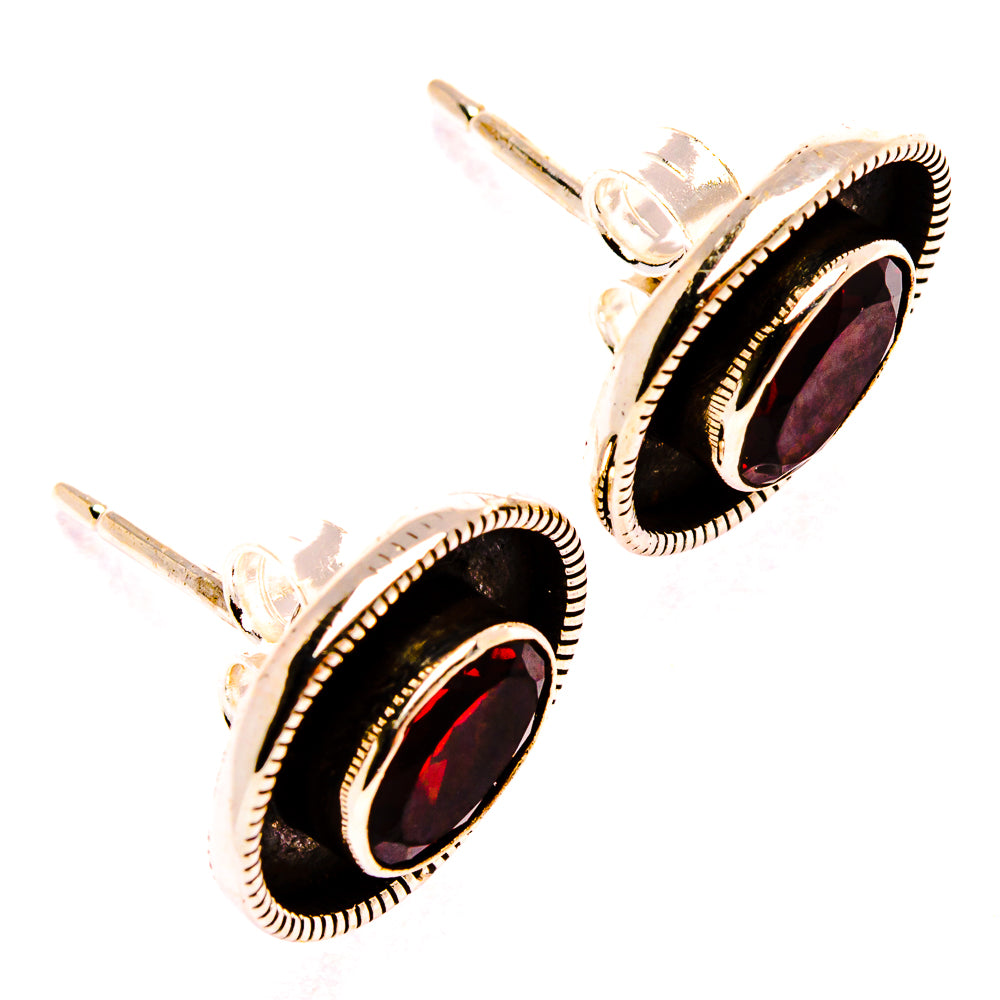 Garnet stud earrings, oval red stones framed by black bezels, sterling silver posts