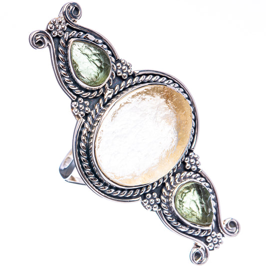 Silver-tone statement ring with oval center stone and two green side stones