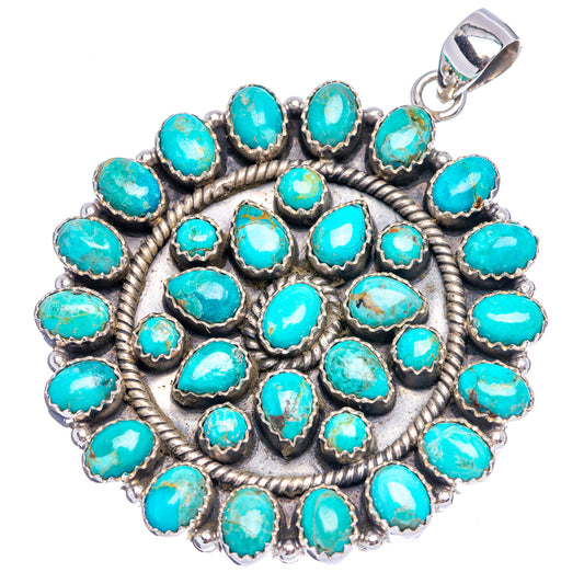 Round turquoise cabochon pendant in sterling silver with loop bail.