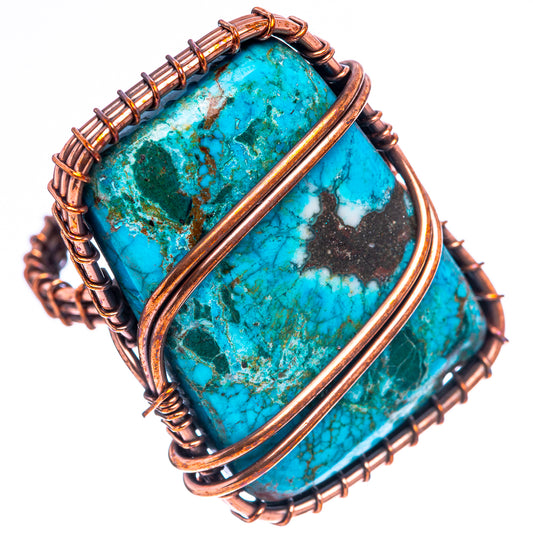Turquoise gemstone ring with oxidized copper wire frame and elongated center stone