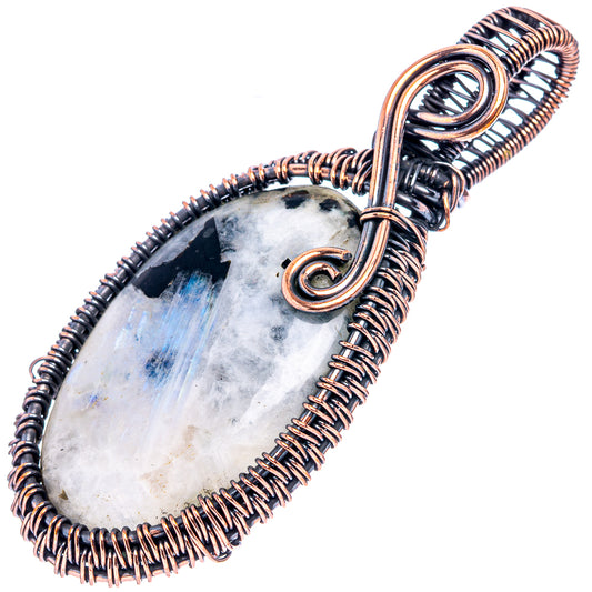 Oval wire-wrapped moonstone pendant with black tourmaline accents, oxidized copper frame