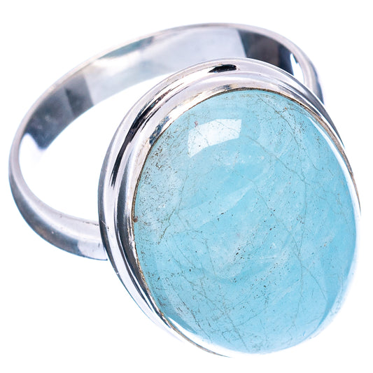 Sterling silver ring with oval blue aquamarine gemstone, angled side view