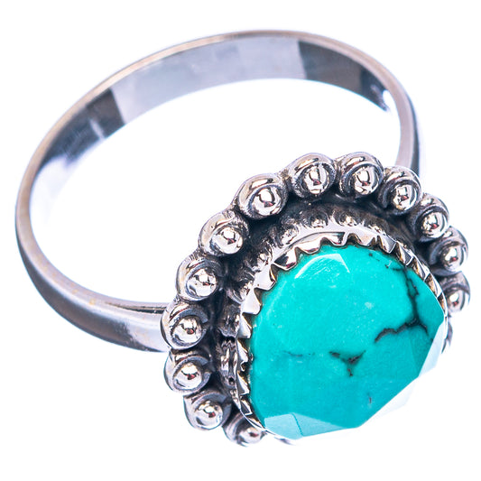 Sterling silver turquoise ring, oval stone in raised bead setting