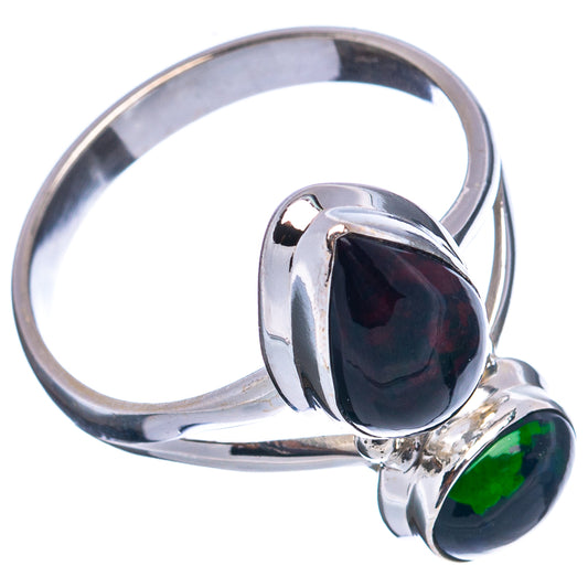 Sterling silver opal ring with large dark oval cabochon and small green opal under bezel