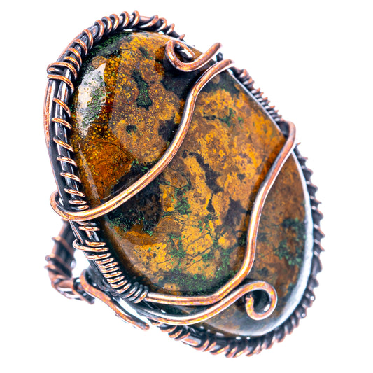 Oxidized copper wire wrap ring with oval green-yellow agate cabochon and dark twisted band