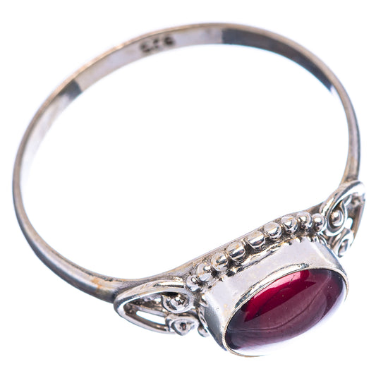 Dainty oval maroon garnet ring with .925 sterling silver band and small round accents