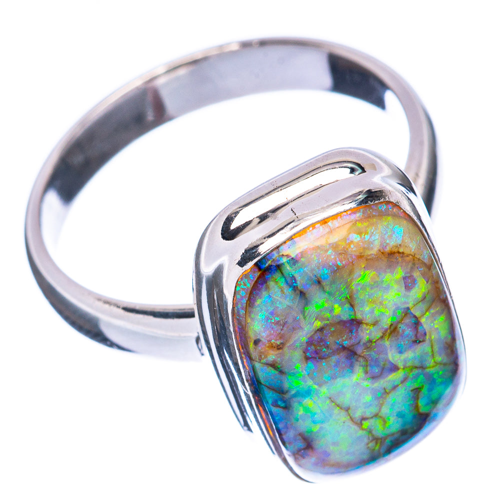 Sterling silver ring featuring a tilted oval opal with blue-green iridescence