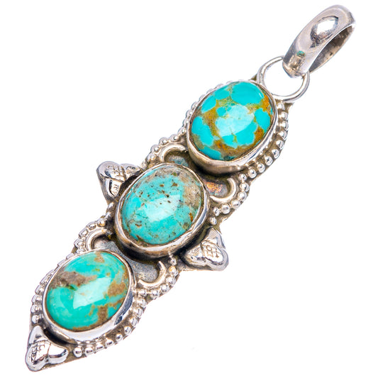 Turquoise oval cabochon pendant in sterling silver with round bail and three-stone design
