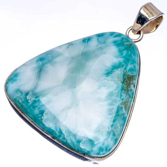 Sterling silver Larimar pendant close-up, blue-green triangle with silver frame and bail