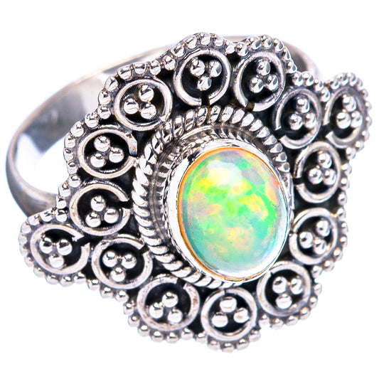 Silver filigree opal ring with oval Ethiopian opal cabochon centerpiece, wide band