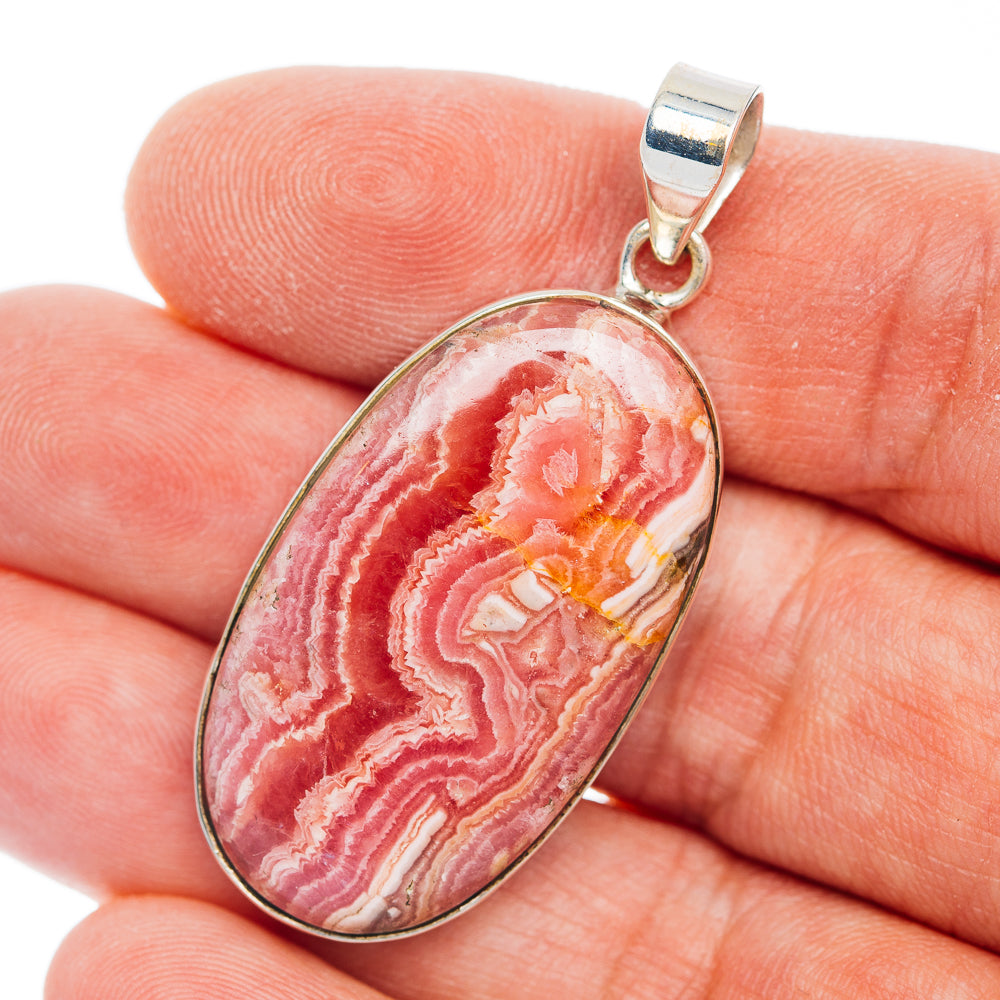 Rhodochrosite oval pendant with .925 sterling silver bail, red and white stone in bezel setting