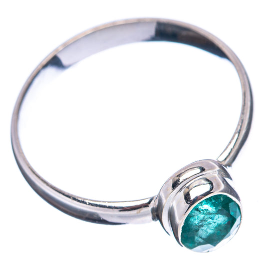 Sterling silver band ring with bezel-set round green gemstone, side view of band