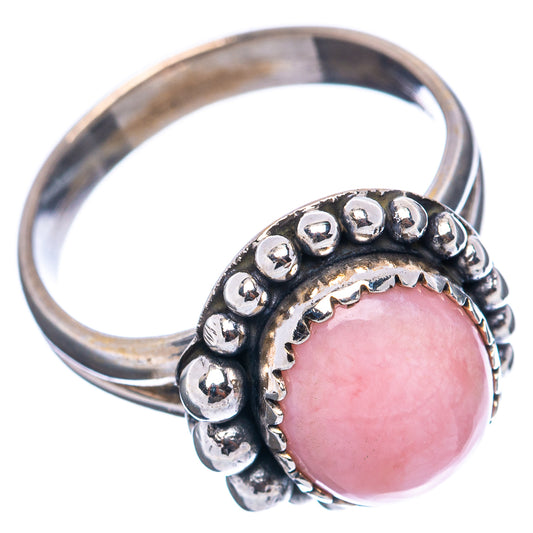 Sterling silver pink opal ring showing band and bead-set halo around oval gemstone