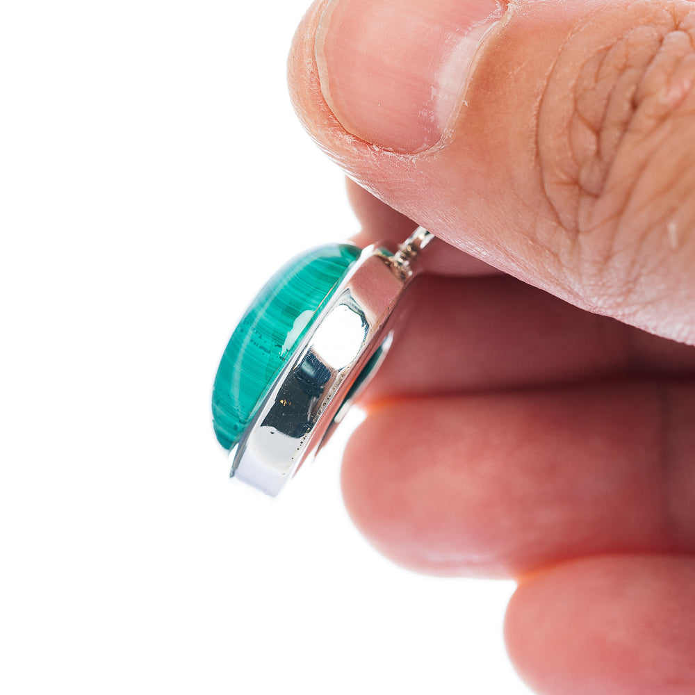 Malachite pendant side view with .925 sterling silver bail and smooth polished bezel
