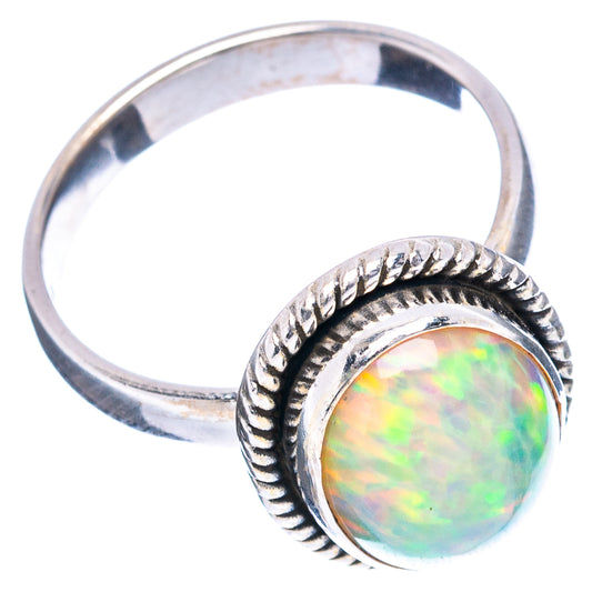 Sterling silver ring with round opal cabochon and raised beaded bezel