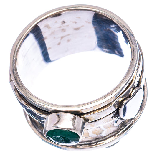Sterling silver ring top view with oval green gemstone bezel on a smooth, shiny band