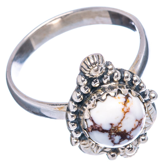 Sterling silver ring featuring round white jasper, detailed side band and petal-style setting