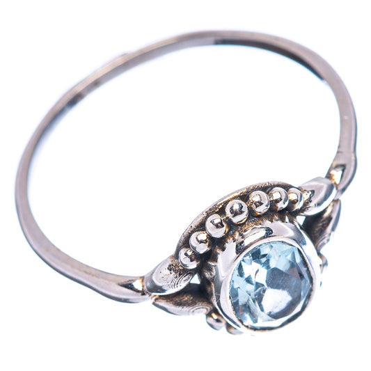 Oval blue gemstone sterling silver ring with scalloped band detail