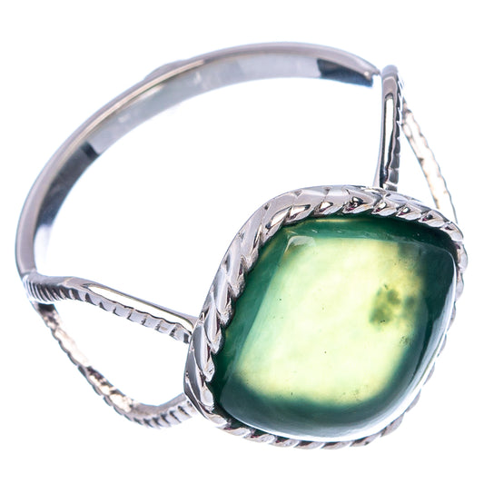 Sterling silver nephrite jade ring with oval green gemstone and braided side band