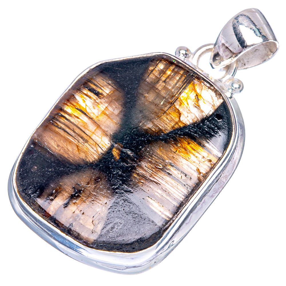 Chiastolite pendant with silver frame, oval stone showing black and gold cross pattern