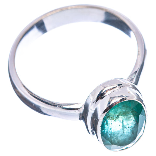 Sterling silver ring with bezel-set oval green emerald and split shoulders