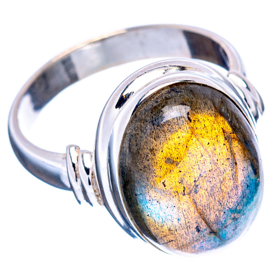 Sterling silver oval labradorite ring with prong-like bezel detail, blue and gold flash