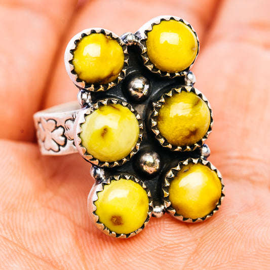 Adjustable sterling silver ring with seven yellow cabochon stones and round silver accents