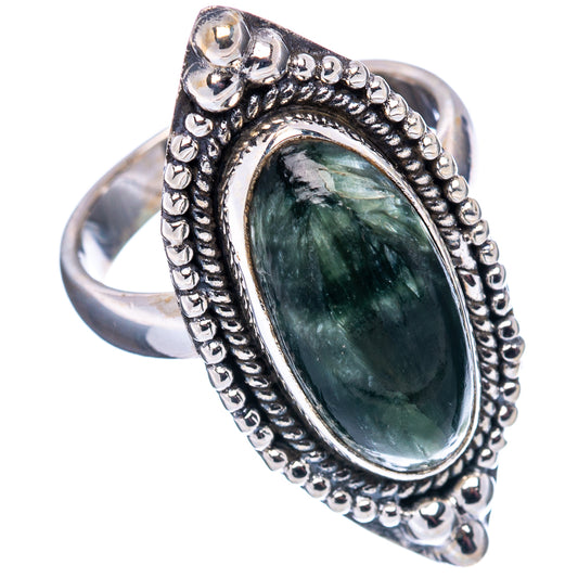 Sterling silver oval green cabochon ring with raised beaded border and split shank