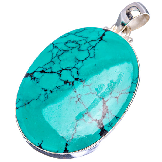 Turquoise oval pendant with black veining, silver bezel and hanging loop