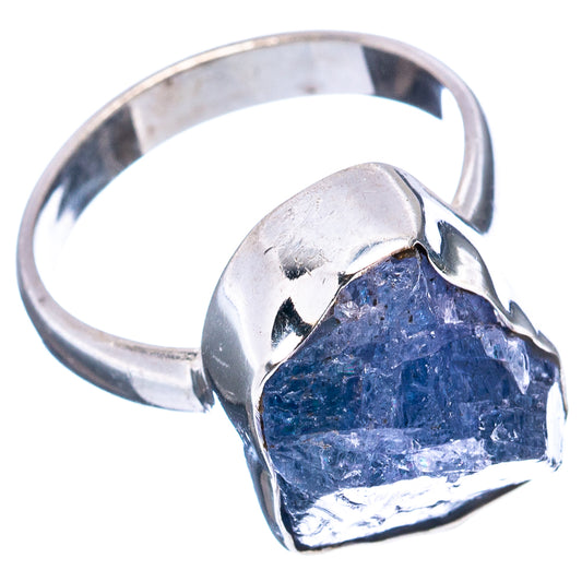 Sterling silver tanzanite ring showing blue rough stone with metal claws and band
