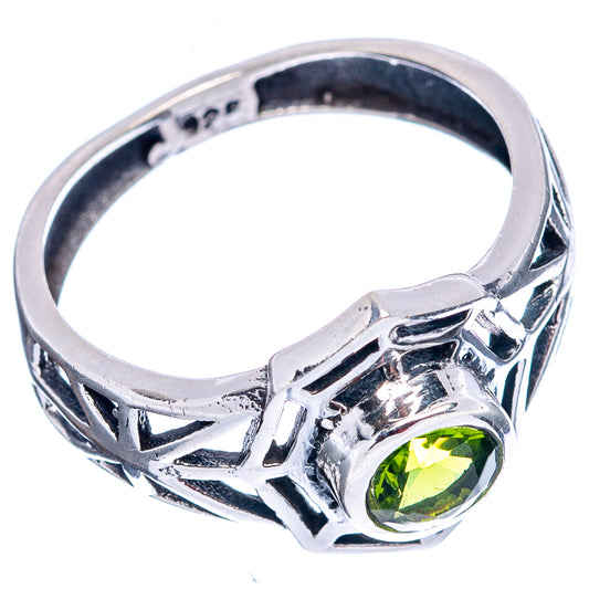 Sterling silver peridot web ring with green gemstone, geometric cutout band