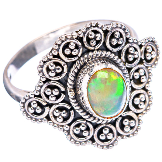 Sterling silver ring with ornate round beadwork and oval green opal cabochon