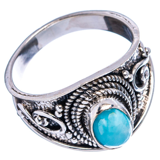 Ornate .925 sterling silver cocktail ring with oval turquoise stone, side view