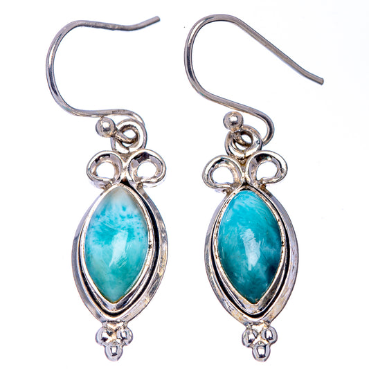 Silver hook earrings with oval blue larimar drops, scalloped bezels and small charms.