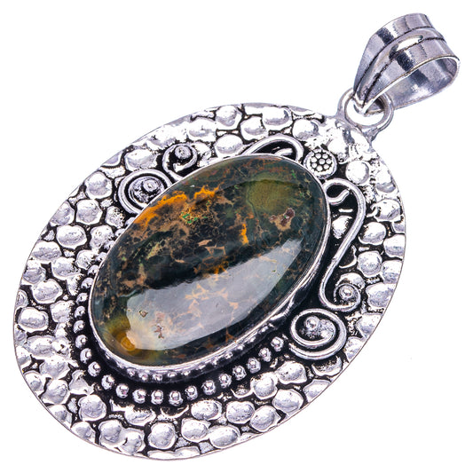 German silver oval pendant with ornate frame and green-orange ocean jasper cabochon