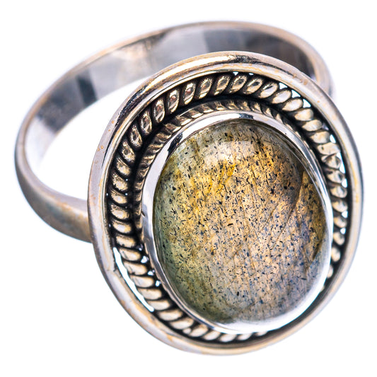 Oval labradorite gemstone ring in .925 sterling silver bezel with yellow-green shimmer