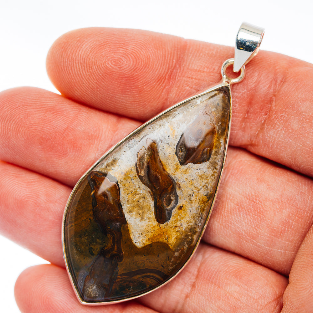 Sterling silver teardrop rock pendant with bronze-brown and black mottled stone inlay
