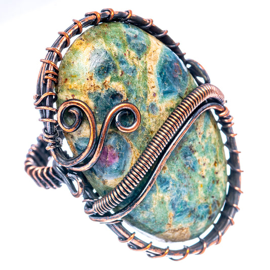Oxidized copper wire wrap ring with oval green-blue gemstone and spiral details