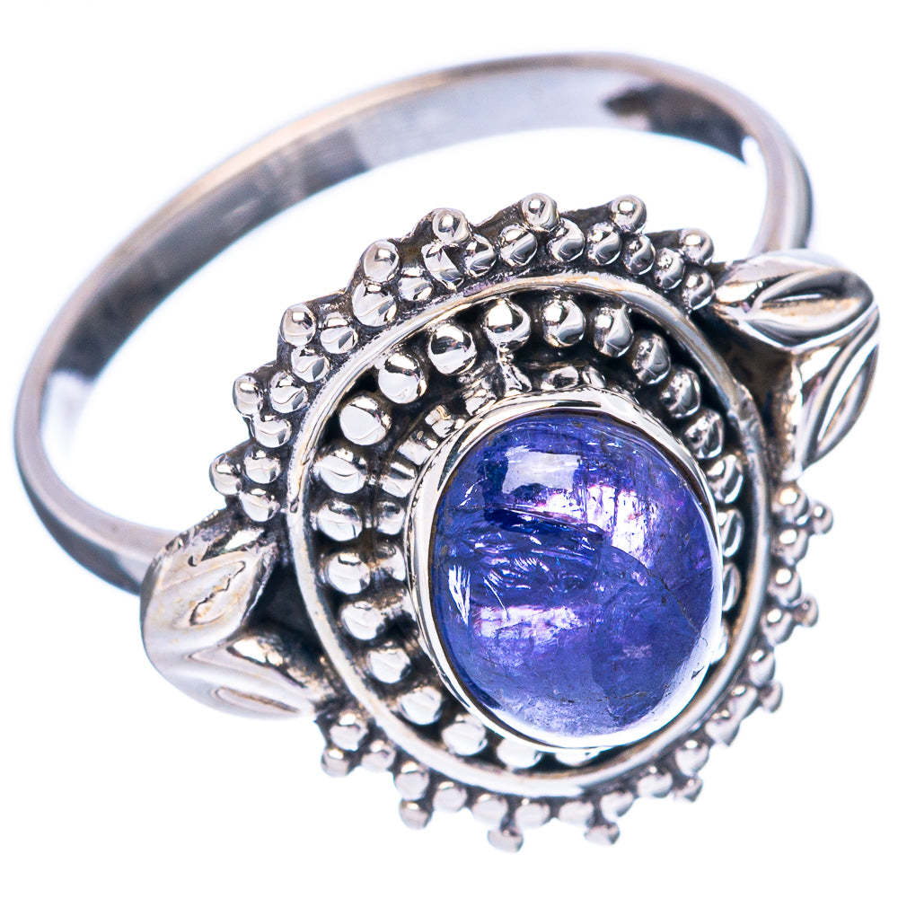 Sterling silver tanzanite ring, side view: oval blue stone in beaded halo with prongs
