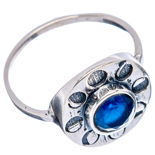 Sterling silver ring with bright blue round gemstone bezel and floral engraving