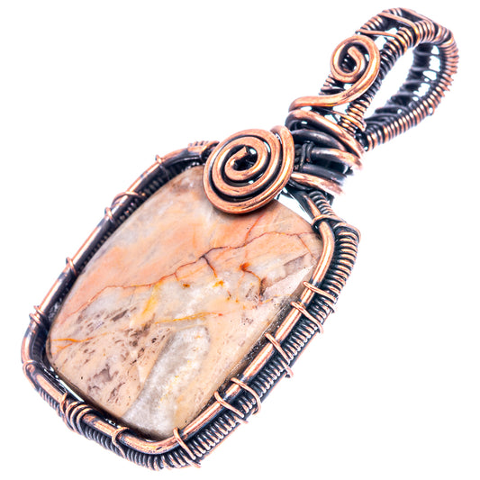 Oxidized copper wire-wrapped pendant with oval pale stone and spiral focal detail