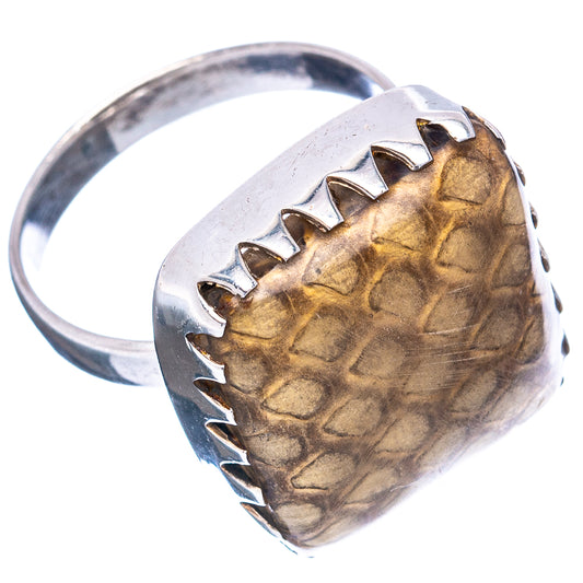 Sterling silver ring showing wood jasper cabochon with segmented bezel and shank