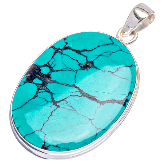 Turquoise oval pendant with black matrix lines, .925 sterling silver bail and frame