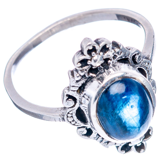 Sterling silver dainty ring with oval blue kyanite cabochon, ornate floral side details