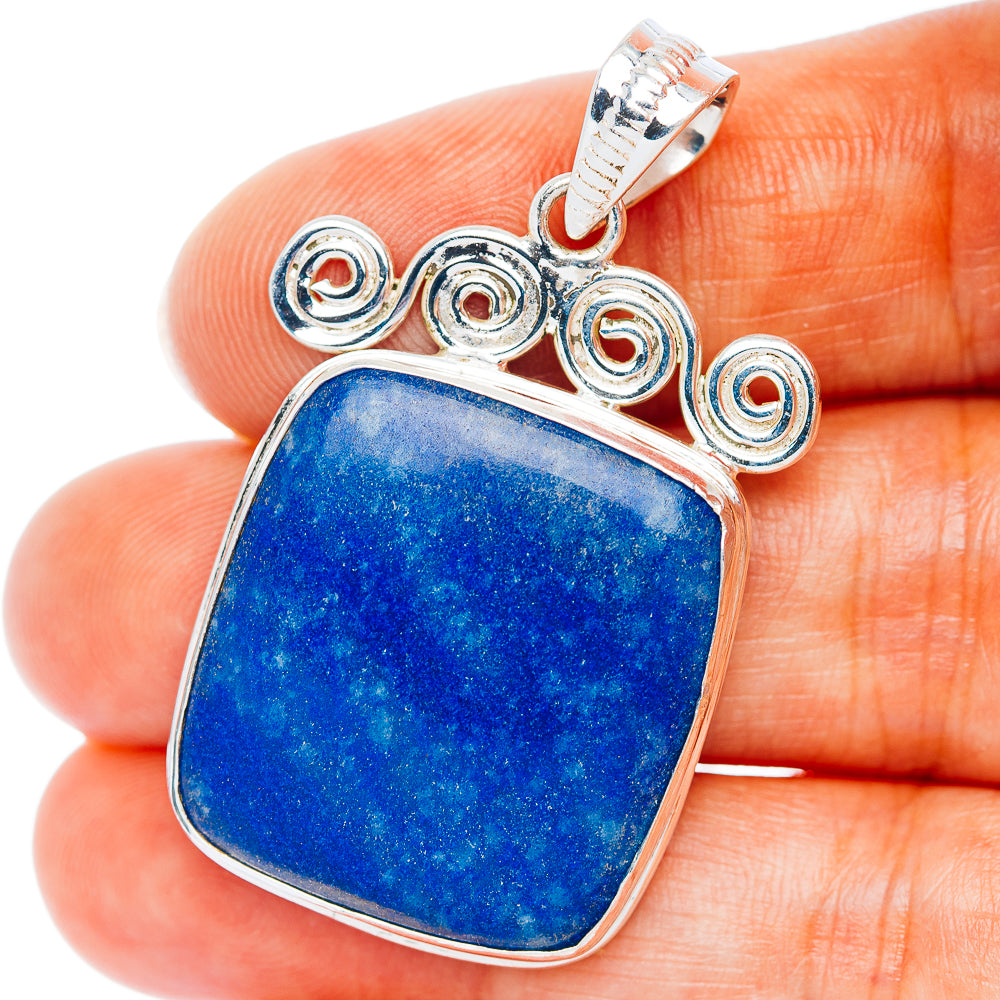 Sterling silver sodalite pendant with blue square stone and decorative swirl bezel