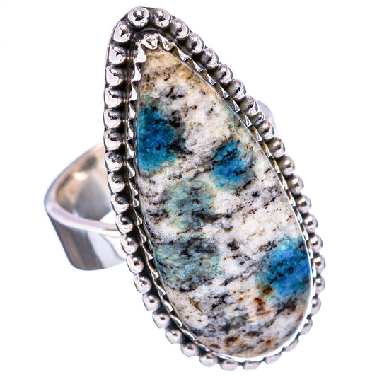Adjustable sterling silver ring featuring an oval blue-and-white stone face